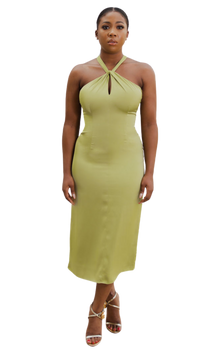 A model wearing an olive halter neck dress