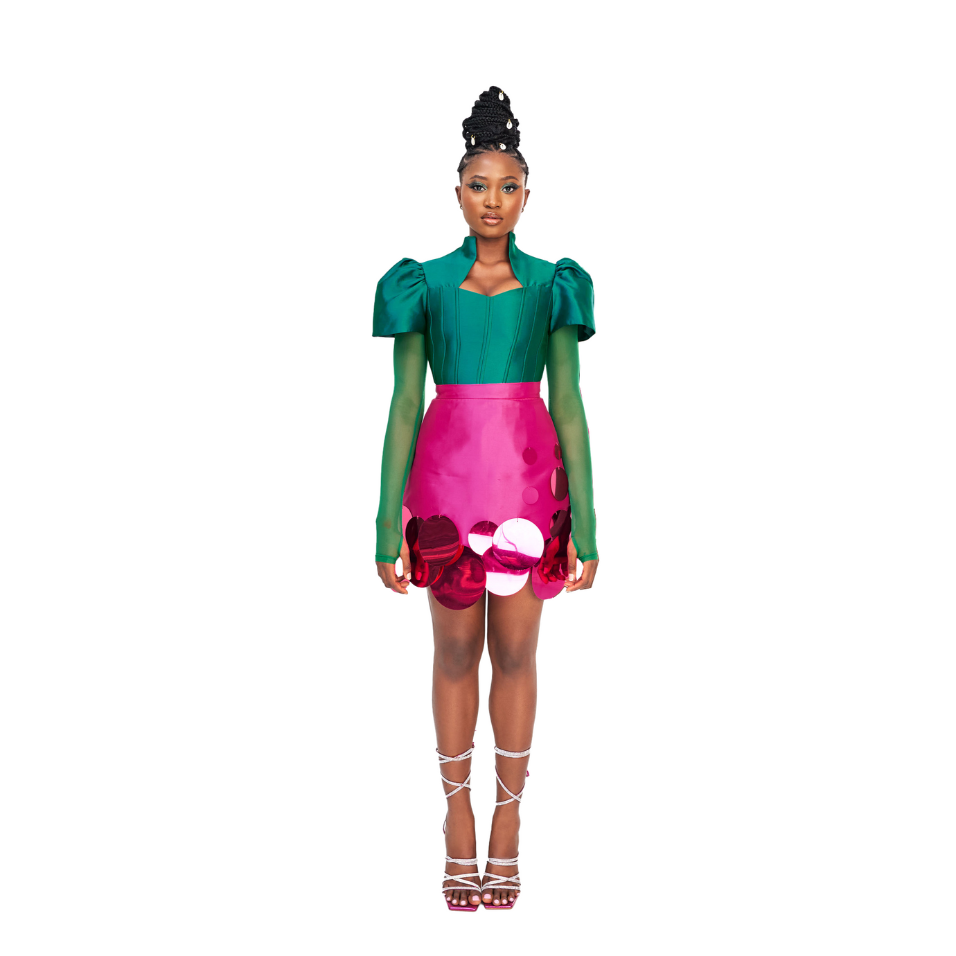 A model wearing a Green top and a Magenta Abeke skirt embellished with sequins