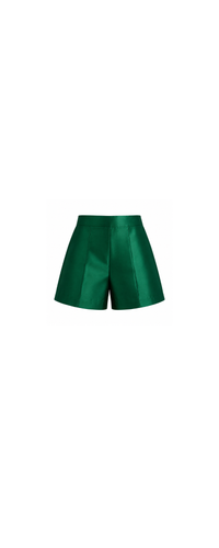 Emerald green tailored kids shorts front view with structured waistband and clean pleated silhouette