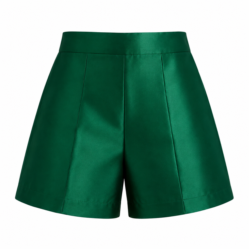 Emerald green tailored kids shorts front view with structured waistband and clean pleated silhouette