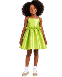 Young girl styled in the Oyin Party Dress for a special occasion, showcasing its playful yet elegant design.