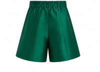 Emerald green tailored kids shorts back view with elasticated waistband and polished satin finish.