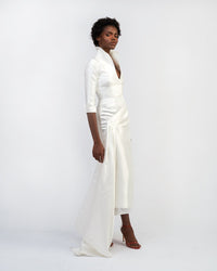 A model wearing a white silk satin dress