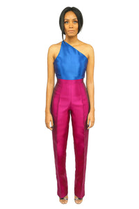 A model wearing a one-shoulder Blue Top and a magenta high waist straight cut pant