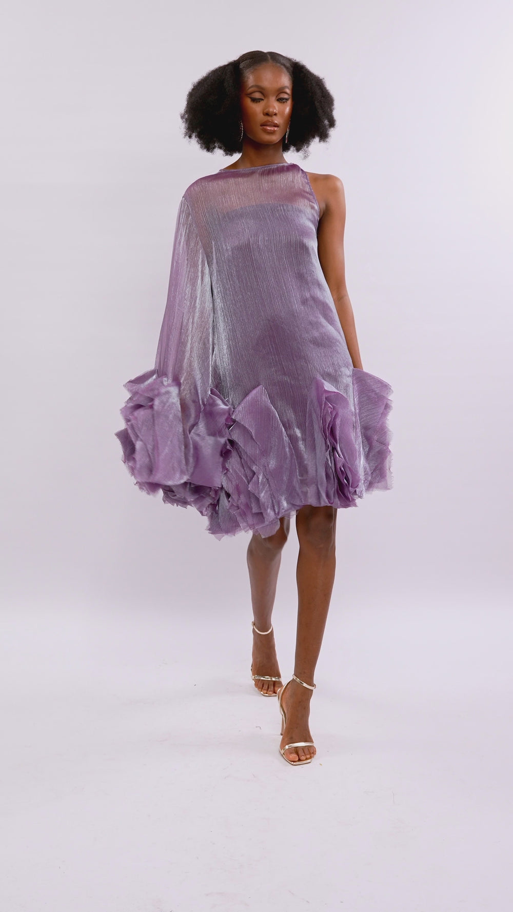 A model wearing a Purple asymetric sleeve mini dress with ruffles and silk slip lining