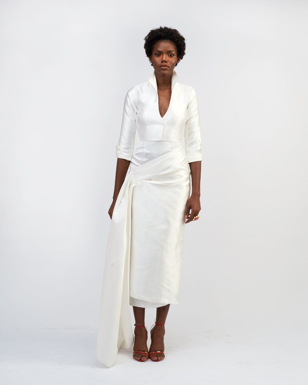 A model wearing a white silk satin dress