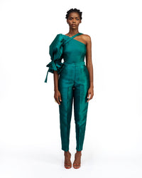 A model wearing a silk satin green top and pants