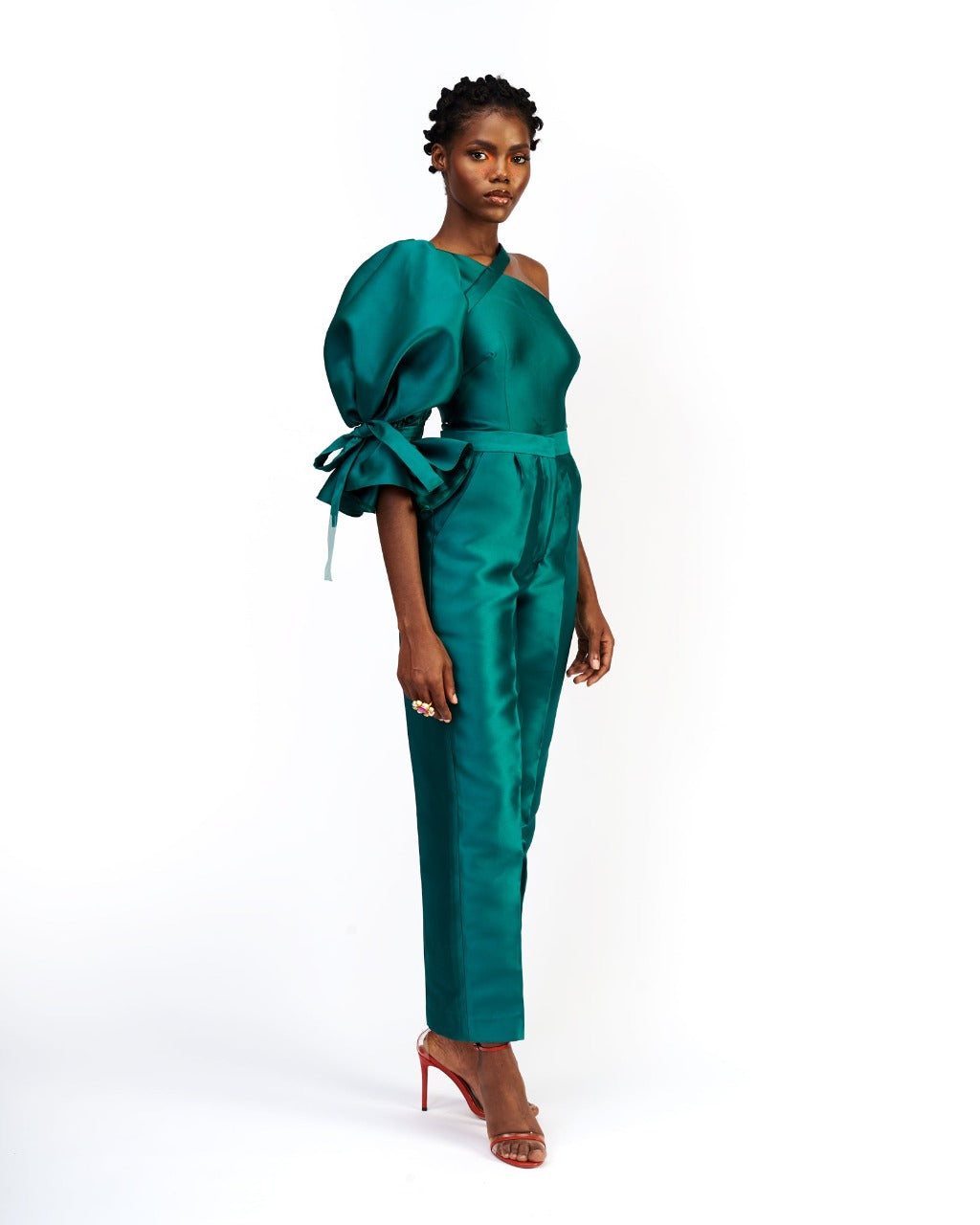 A model wearing a silk satin green top and pants