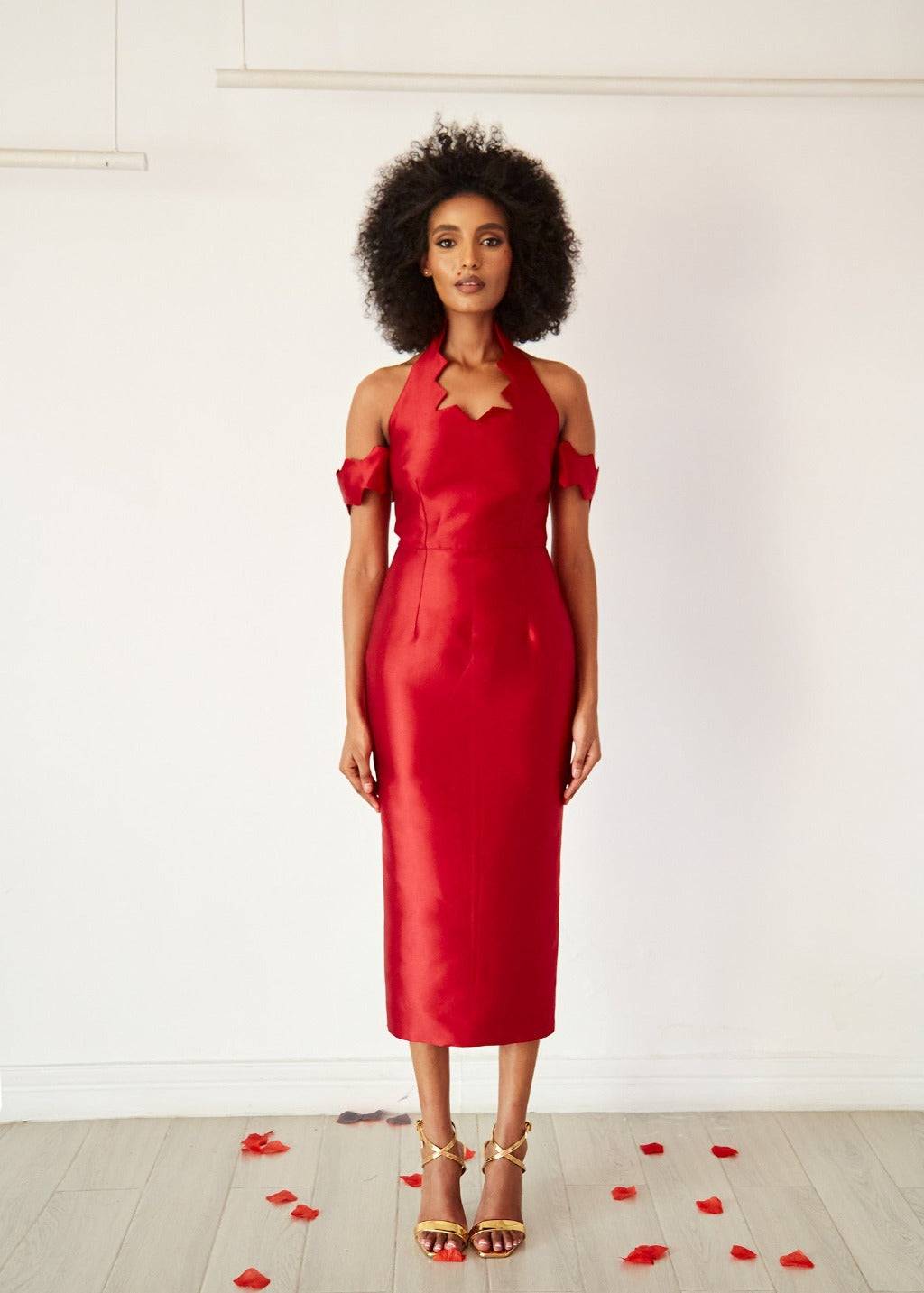 A model wearing a fitted mid-length Wine halter neck dress