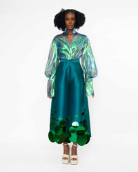 A model wearing an Iridescent Green top and a Green pant with sequins embellished