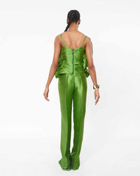 The back of a model wearing an Olive top with ruffle detailing and an Olive straight cut pant