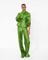 A model wearing an Olive top with ruffle detailing and an Olive straight cut pant